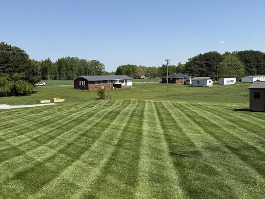 Striped lawn maintained by OJ LANDSCAPE